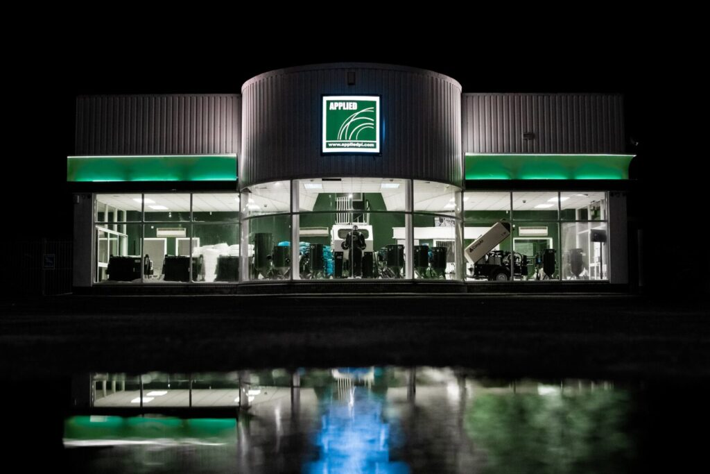 The front of the Applied PI building at night